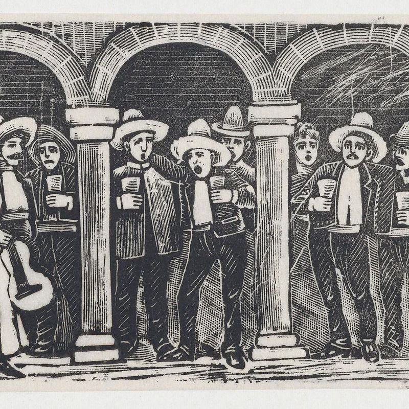 Musicians standing in an arcade having a drink