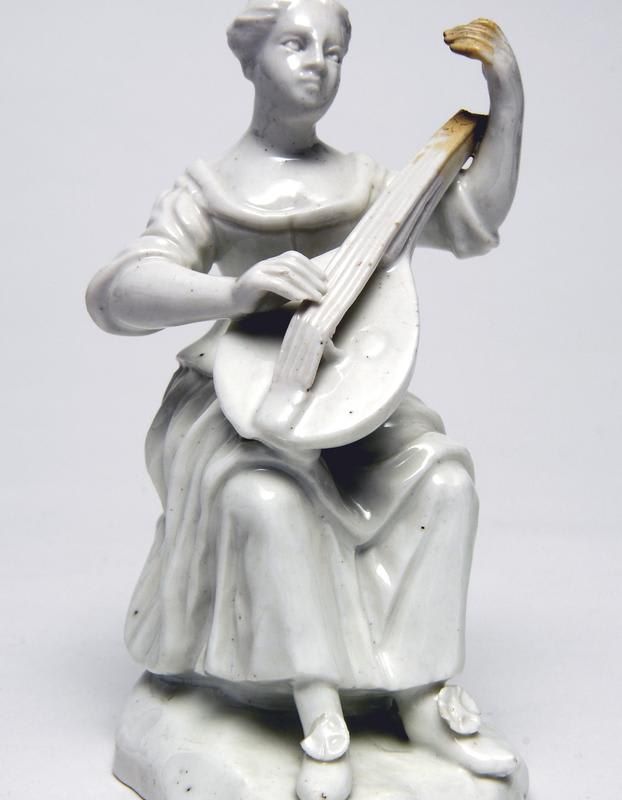 Figure: Woman playing mandolin