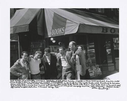 Bob Donlon (Rob Donnelly, Kerouac’s Desolation Angels), Neal Cassady, myself in black corduroy jacket, Bay Area poets’ “Court Painter” Robert La Vigne & poet Lawrence Ferlinghetti in front of his City Lights Books shop, Broadway & Columbus Avenue North Beach. Donlon worked seasonally as Las Vegas waiter & oft drank with Jack K., Neal looks good in tee shirt, Howl first printing hadn’t arrived from England yet (500 copies), we were just hanging around, Peter Orlovsky stepped back off curb & snapped shot, San Francisco spring 1956.