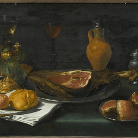 Ham, bread and jug with salt shaker and wine glasses