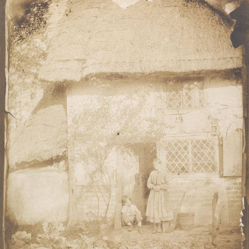 Two Children in Front of Cottage
