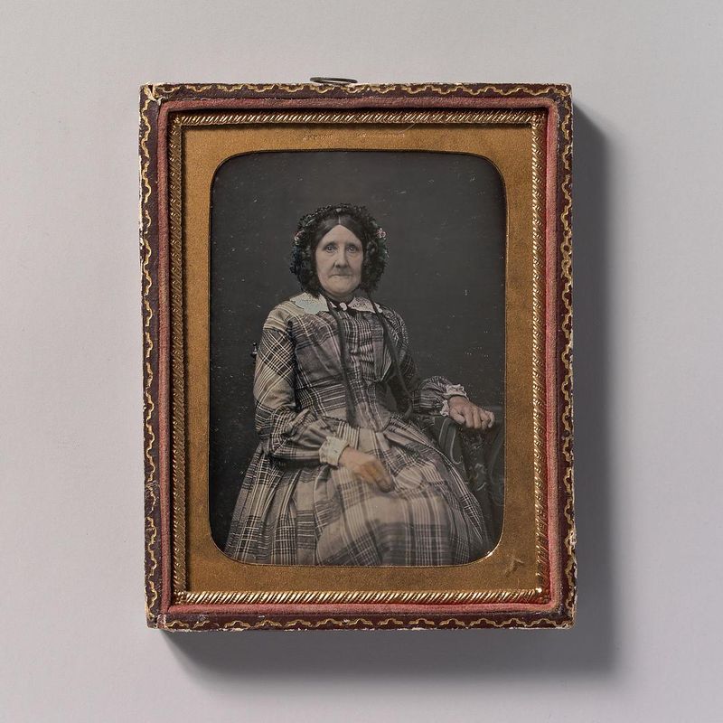 [Seated Elderly Woman Wearing Plaid Dress and Bonnet]