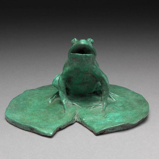 A Frog sitting on a lily pad