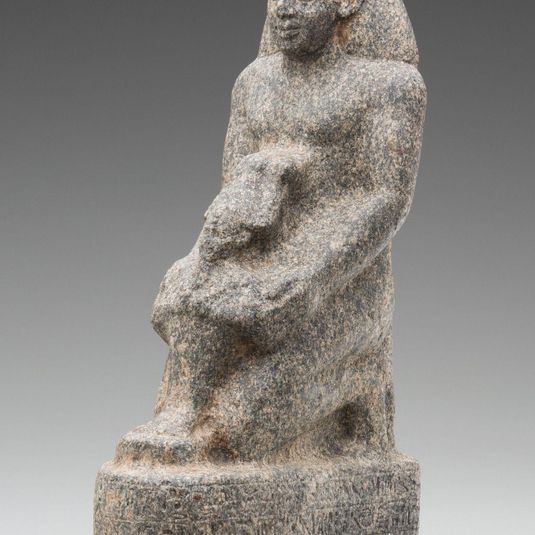 Kneeling Man Holding a Statue of the God Osiris