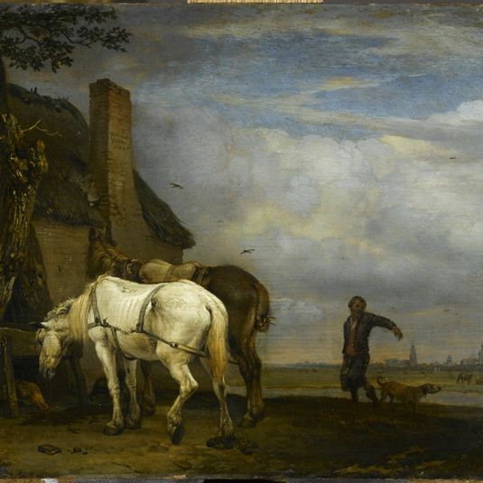 Two horses near a trough in front of a cottage