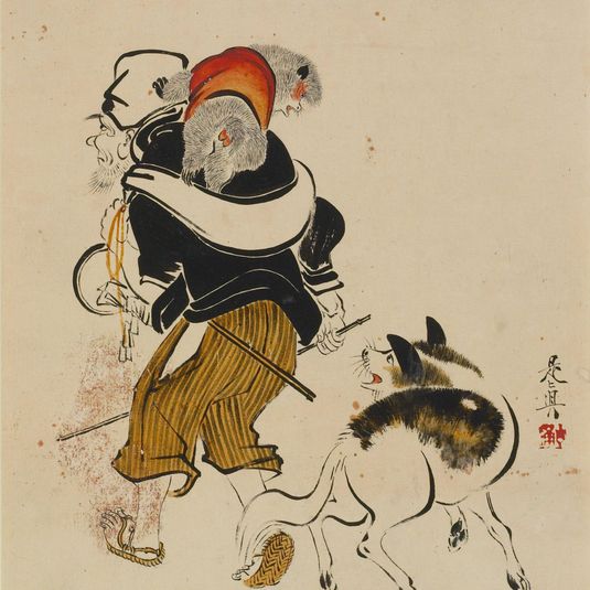 Dog barking at a monkey trainer
