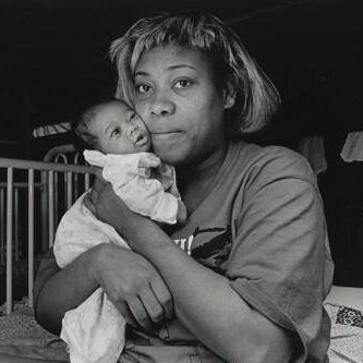 It's 3:00 a.m. No way to sleep. Imaginary bedbugs chewing at me. The air is oppressive, like being buried alive. The cries of asthmatic children sniffling, screaming, sleep-talking keeps me on edge. In semi-darkness I wander among the beds, seeing mothers wrapped around their babies, like bears in hibernation. In one lower bunk, I find an exhausted mother, Pam, rocking her wailing week-old daughter. Pams face glows with inner peace. She is one of the lucky ones. She escaped an abusive relationship and found shelter here. Olive Branch Mission, Chicago.