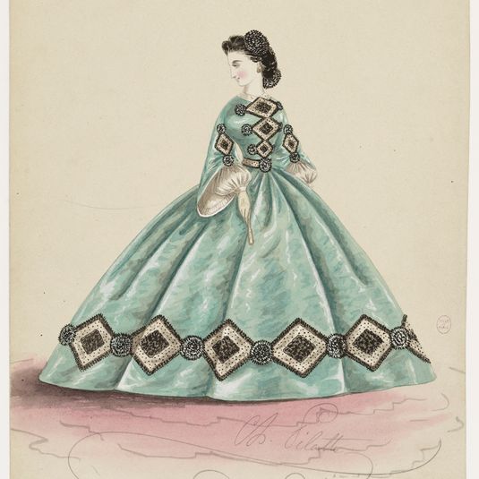 Femme en robe vert, blanc et noir